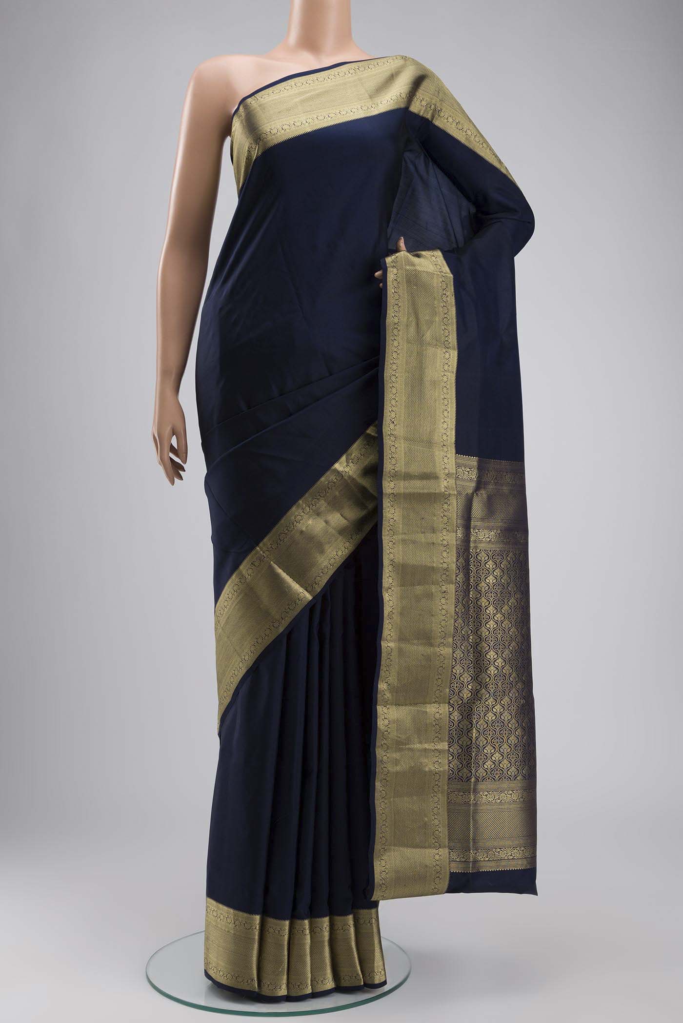 Navy Blue Soft Silk Saree with Plain Body and Zari Border displayed on a mannequin