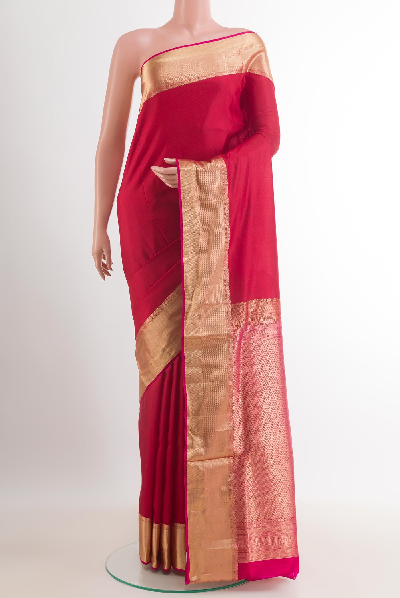 Red Soft Silk Saree with Plain Body and Zari Border.  displayed on a mannequin