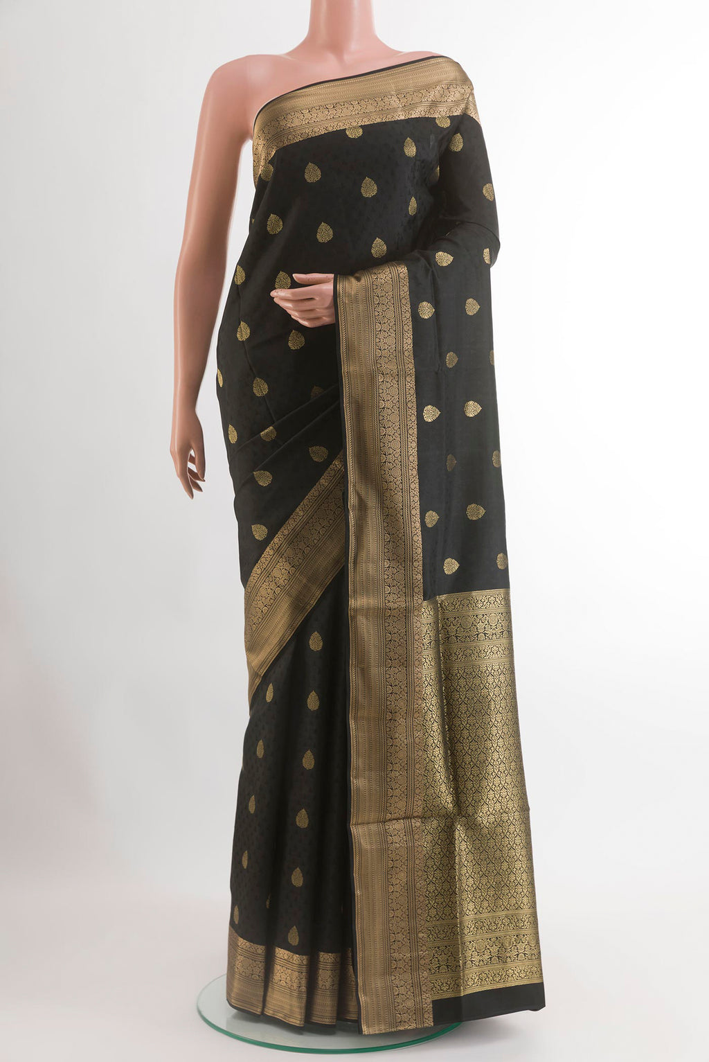 Black Soft Silk Saree with Jacquard With Zari Butta on the body and Zari Border.  displayed on a mannequin