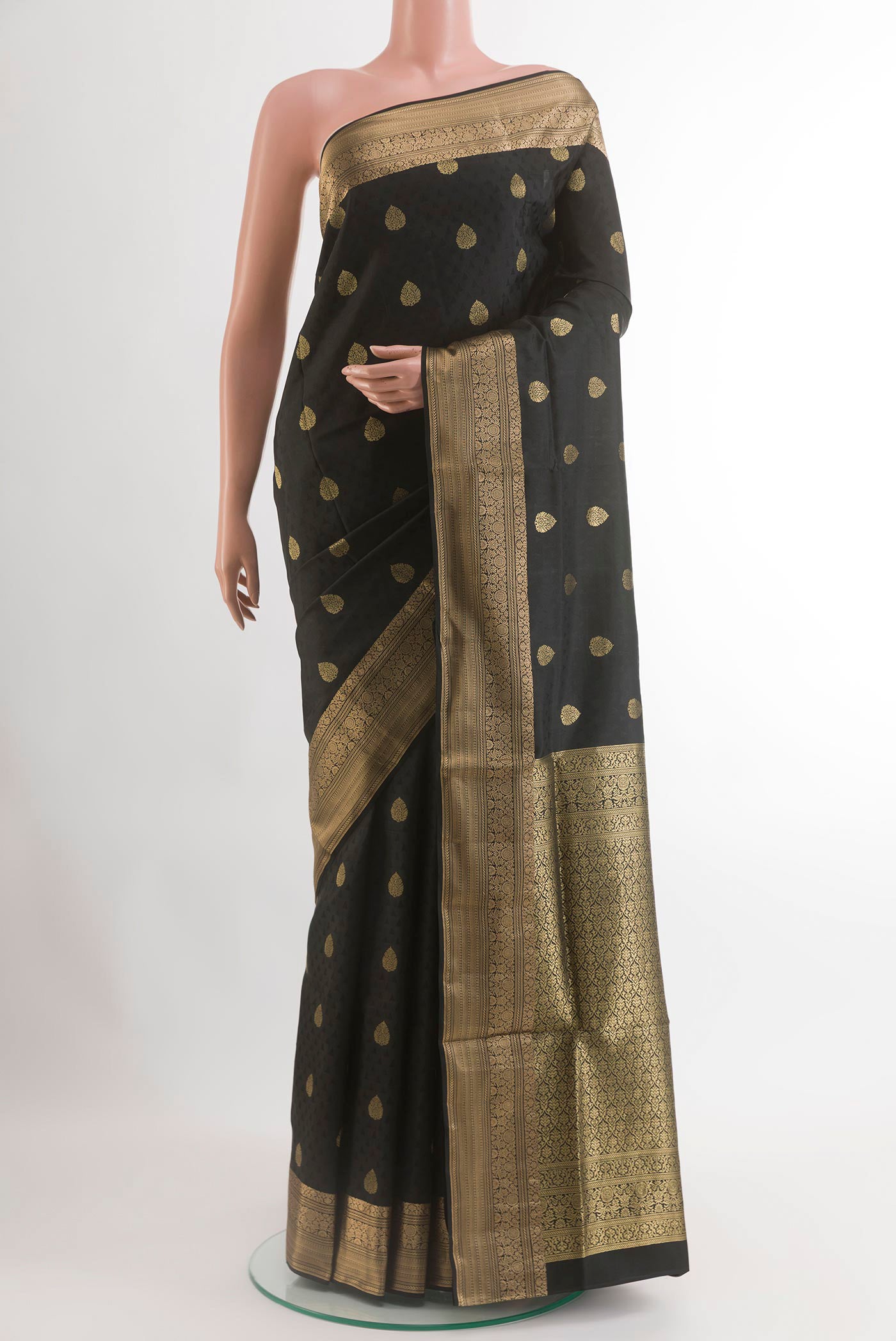 Black Soft Silk Saree with Jacquard With Zari Butta on the body and Zari Border.  displayed on a mannequin