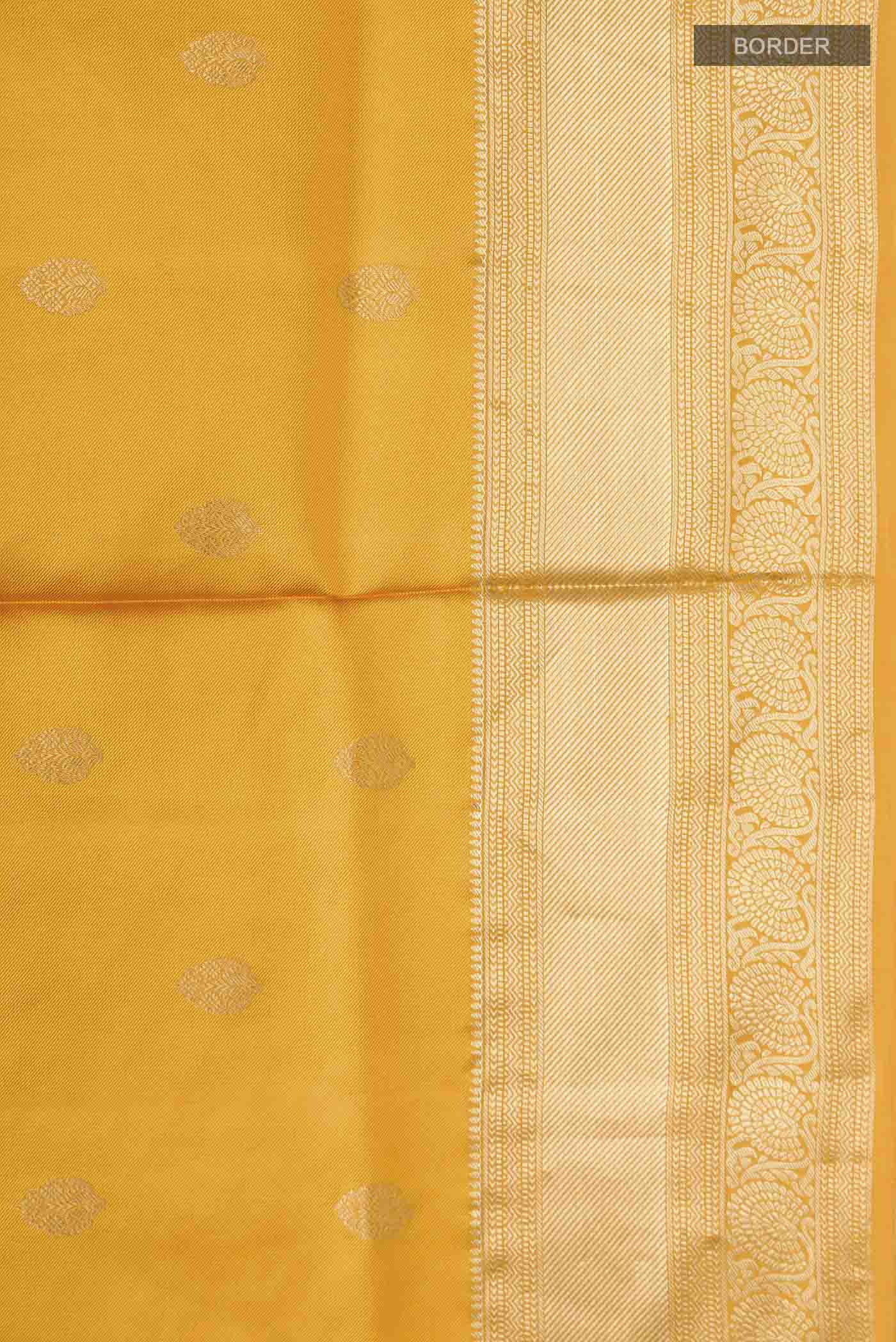 Border image of Yellow Soft Silk Saree with Zari Butta on the body and Zari Border