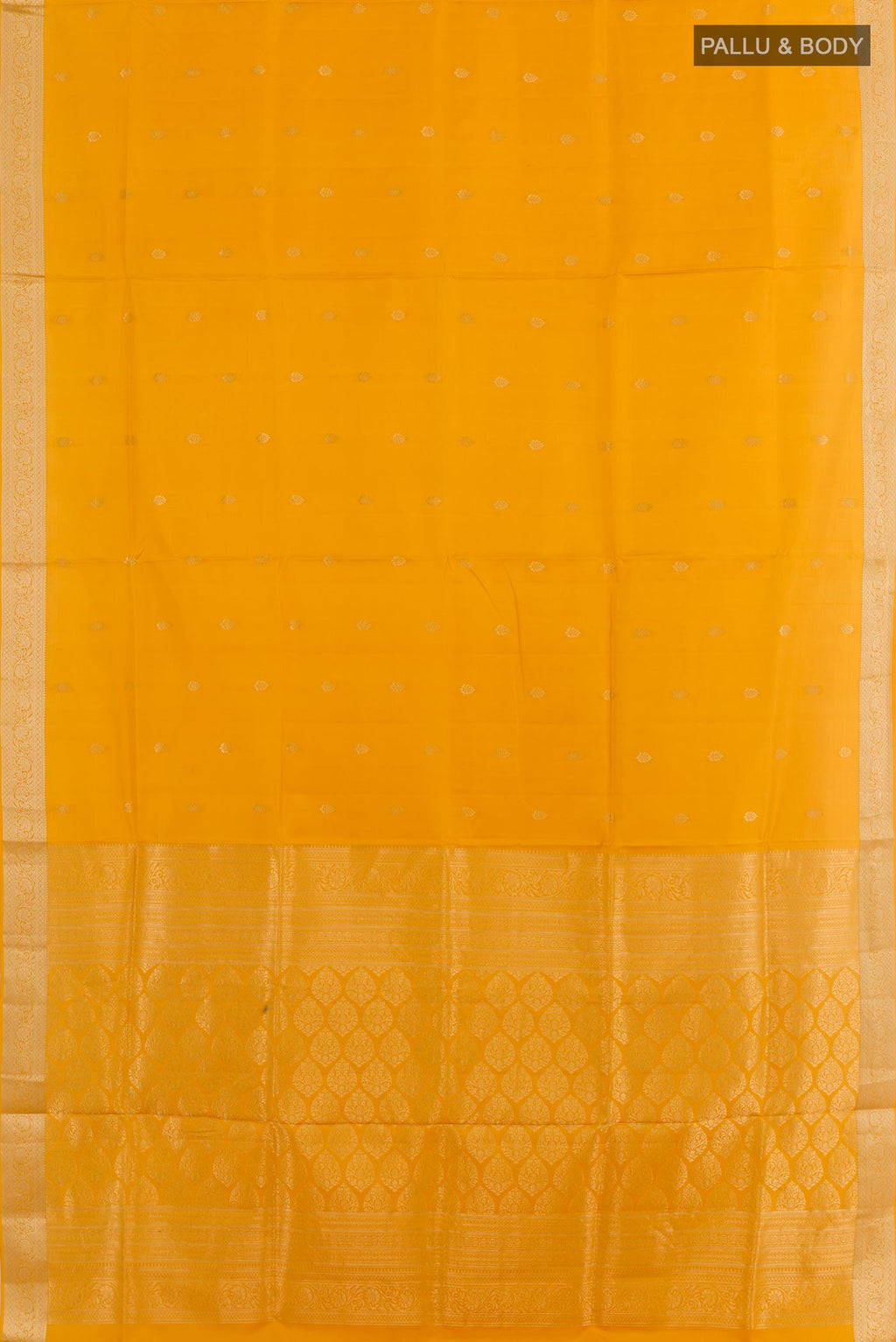 Flat view of Mustard Soft Silk Saree with Zari Butta on the body and Zari Border. 