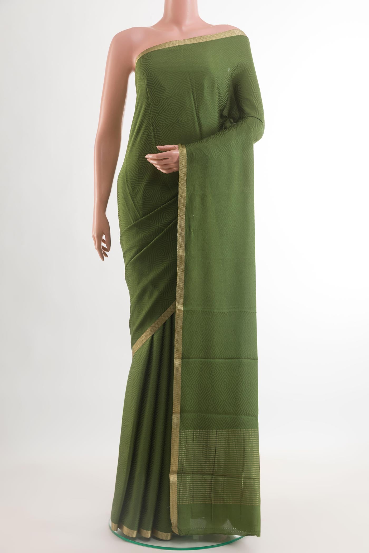 Olive Green Mysore Crepe Saree with Jacquard design on the body and Zari Border.  displayed on a mannequin