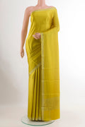 Yellow Mysore Crepe Saree with Plain Body and Zari Border.  displayed on a mannequin