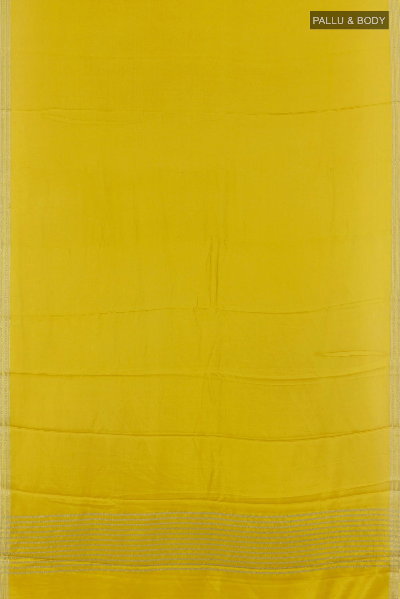 Flat view of Yellow Mysore Crepe Saree with Plain Body and Zari Border. 