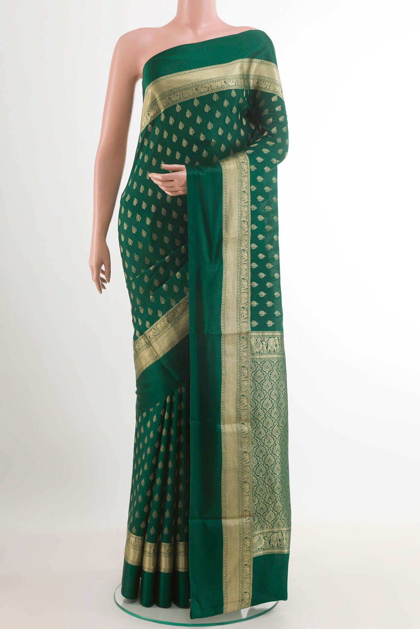 Green Mysore Crepe Saree with Zari Butta on the body and Zari Border.  displayed on a mannequin