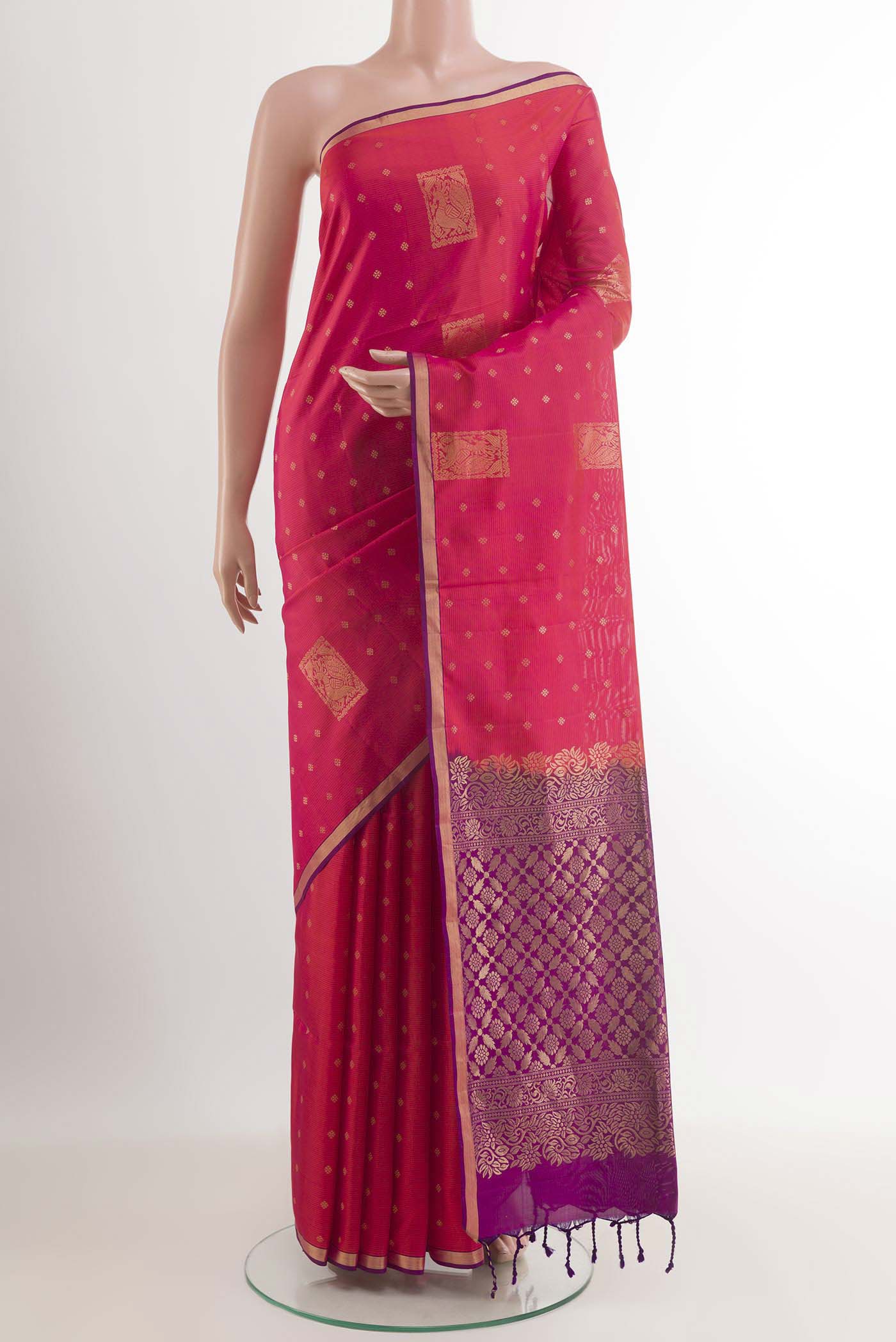 Pink Soft Silk Saree with Zari Butta on the body and Zari Border.  displayed on a mannequin
