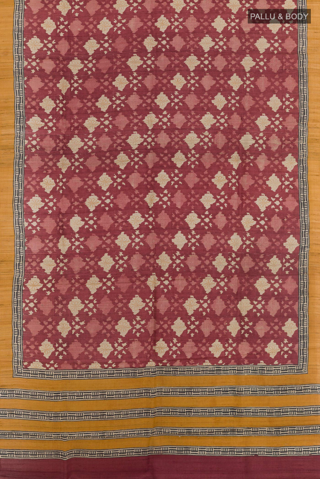 Flat view of Magenta Tussar Saree with Printed design on the body and Plain Border. 
