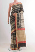 Black Tussar Saree with Printed design on the body and Zari Border displayed on a mannequin