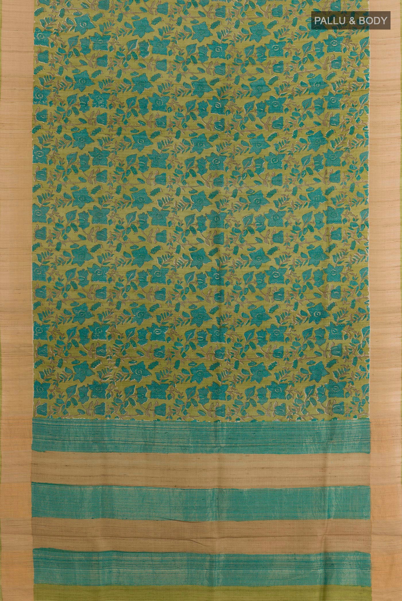 Flat view of Green Tussar Saree with Printed design on the body and Zari Border. 