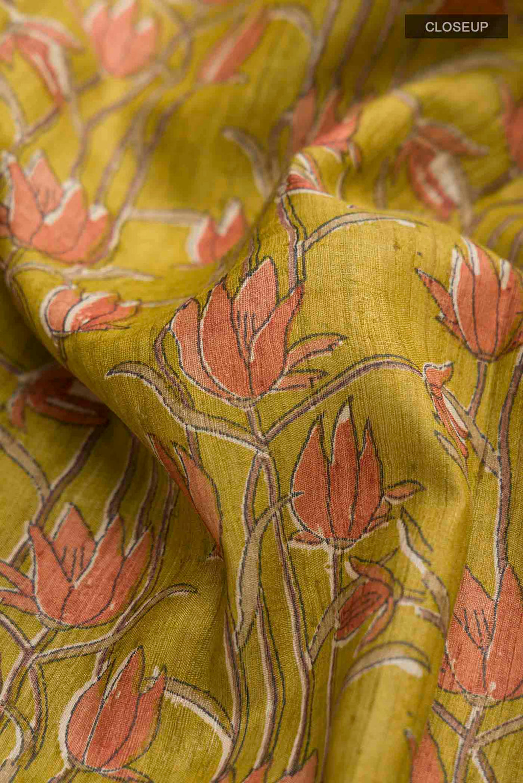 Close up of Green Bhagalpuri Tussar Silk Saree with Printed design on the body and Plain Border displaying folds