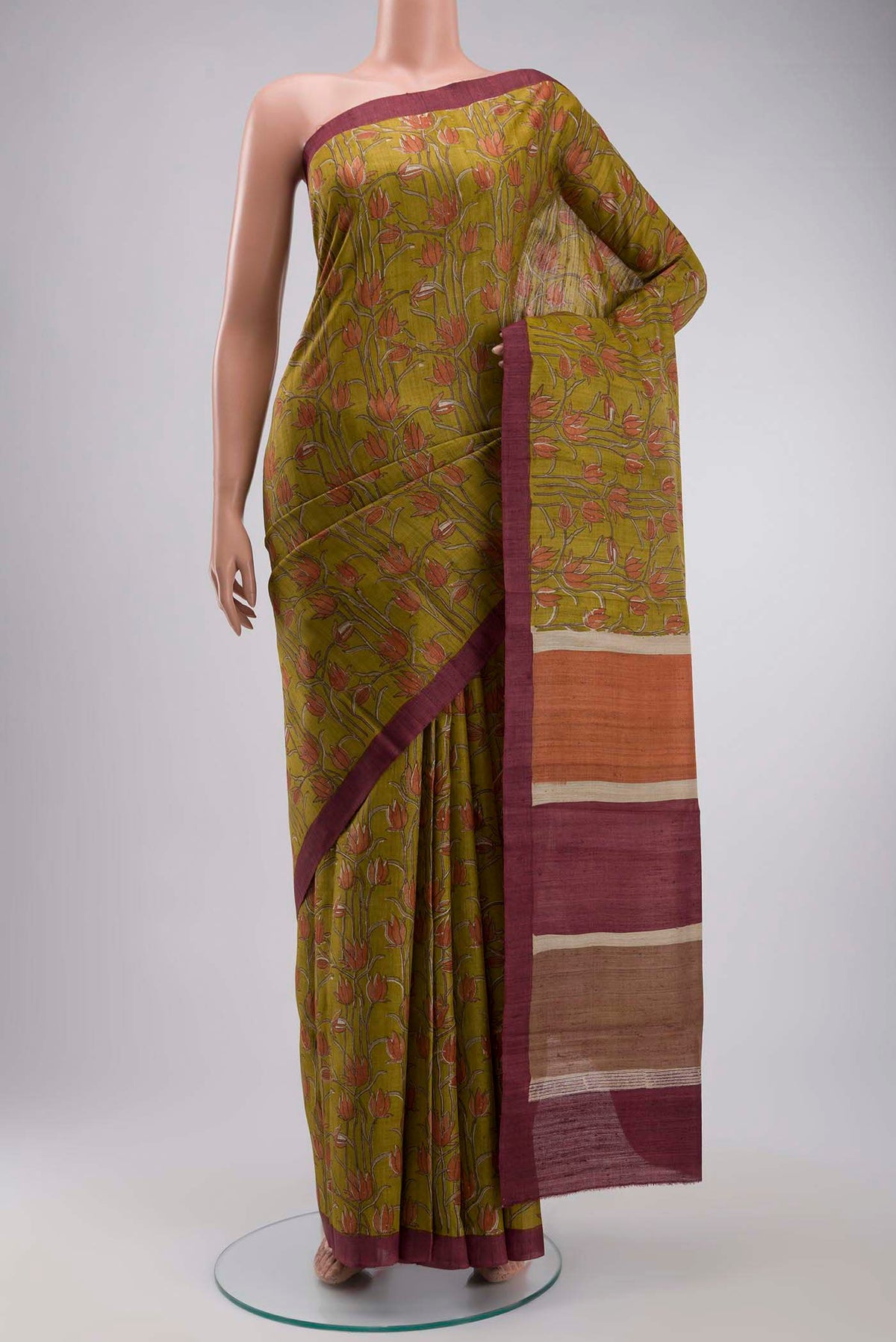 Green Bhagalpuri Tussar Silk Saree with Printed design on the body and Plain Border displayed on a mannequin