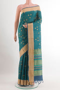 Blue Tussar Saree with Printed design on the body and Zari Border.  displayed on a mannequin