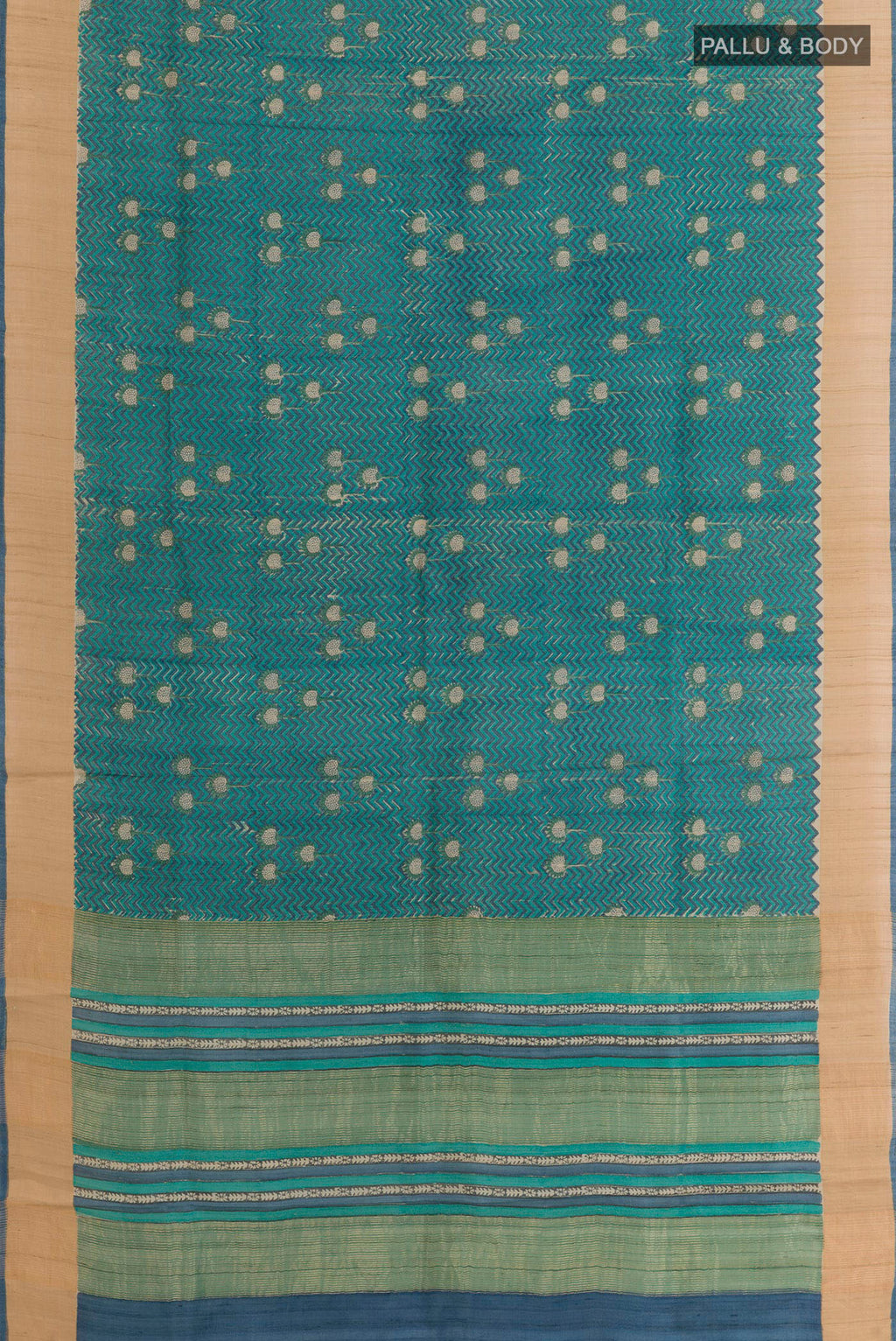 Flat view of Blue Tussar Saree with Printed design on the body and Zari Border. 