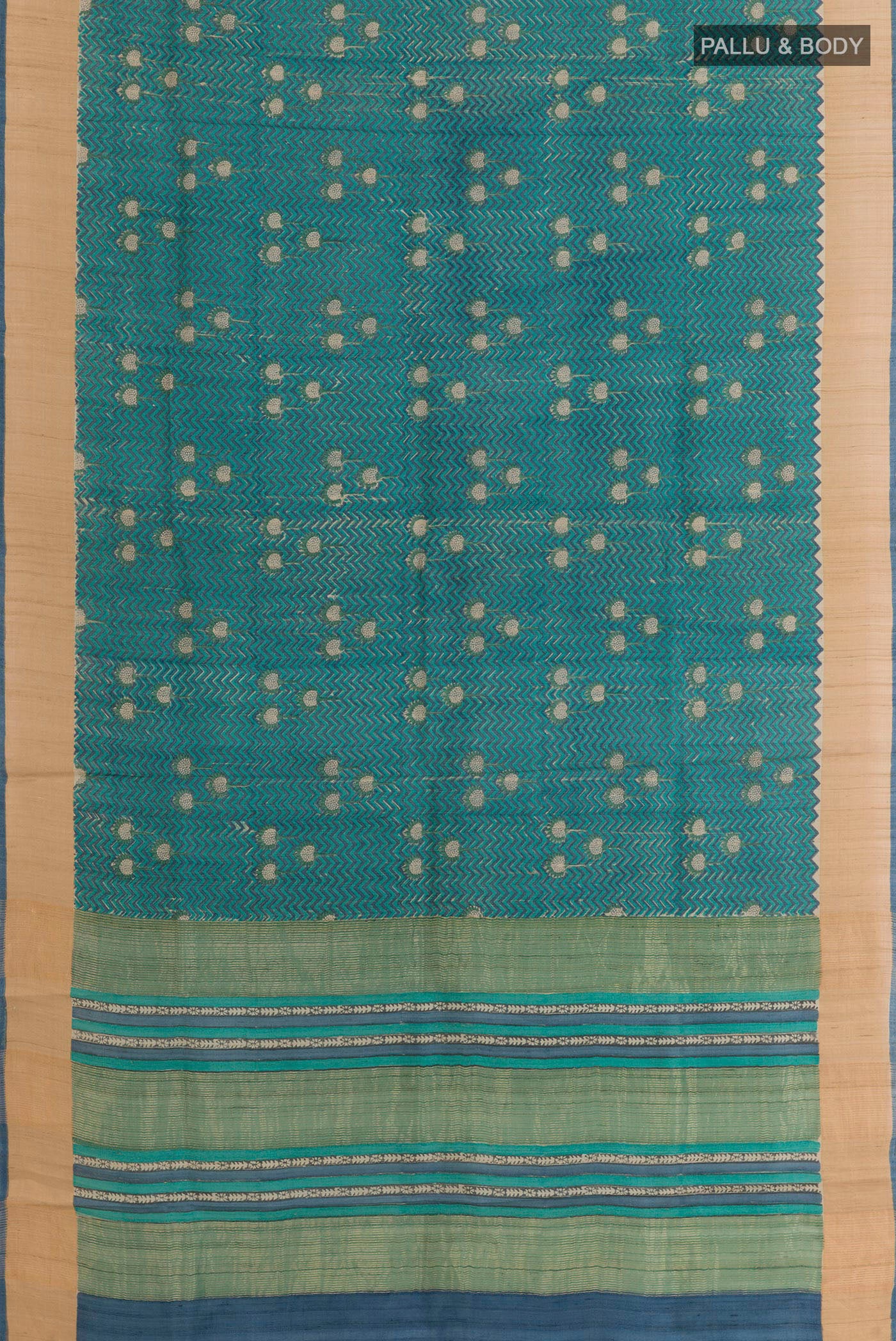 Flat view of Blue Tussar Saree with Printed design on the body and Zari Border. 