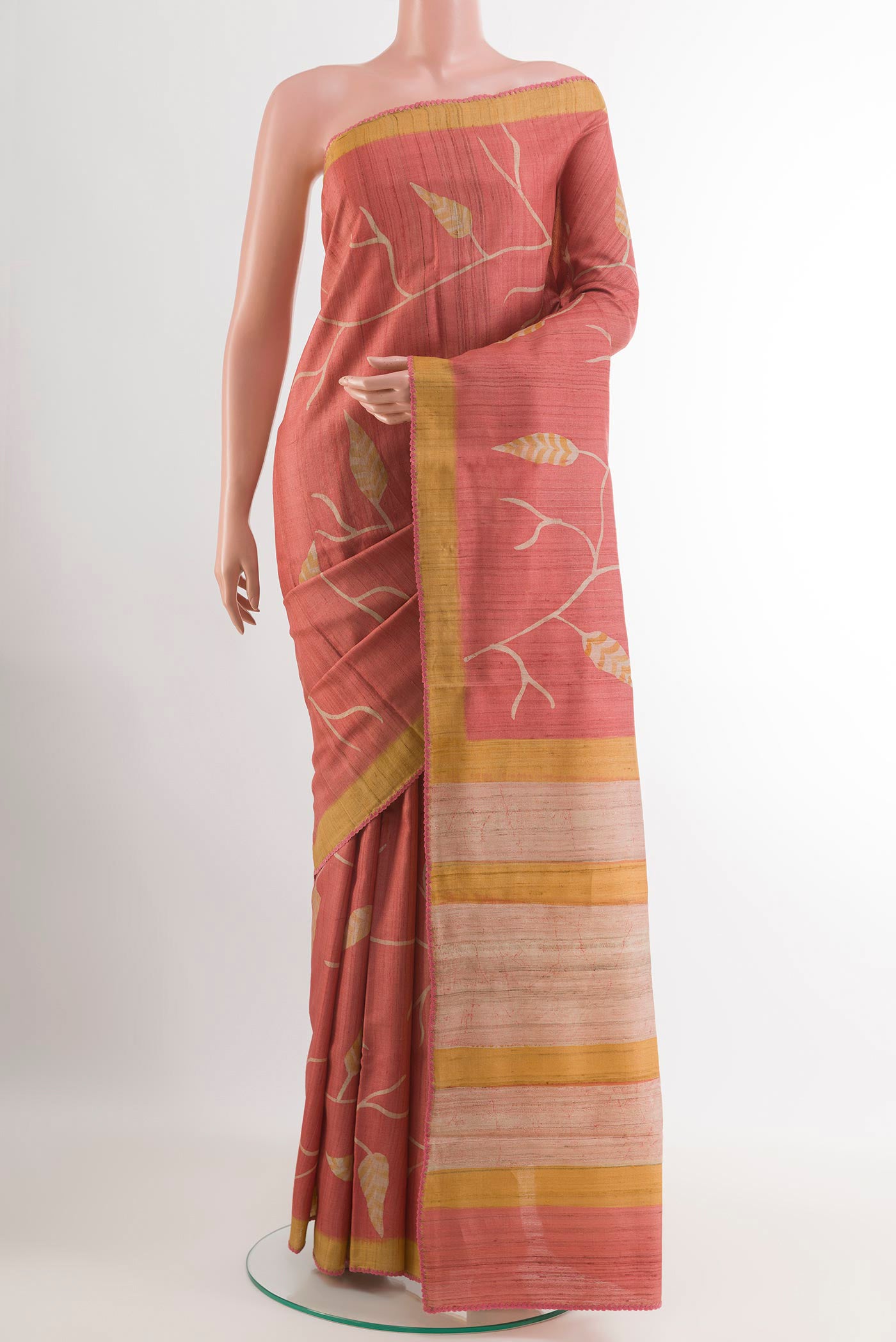 Pink Tussar Saree with Printed design on the body and Plain Border.  displayed on a mannequin