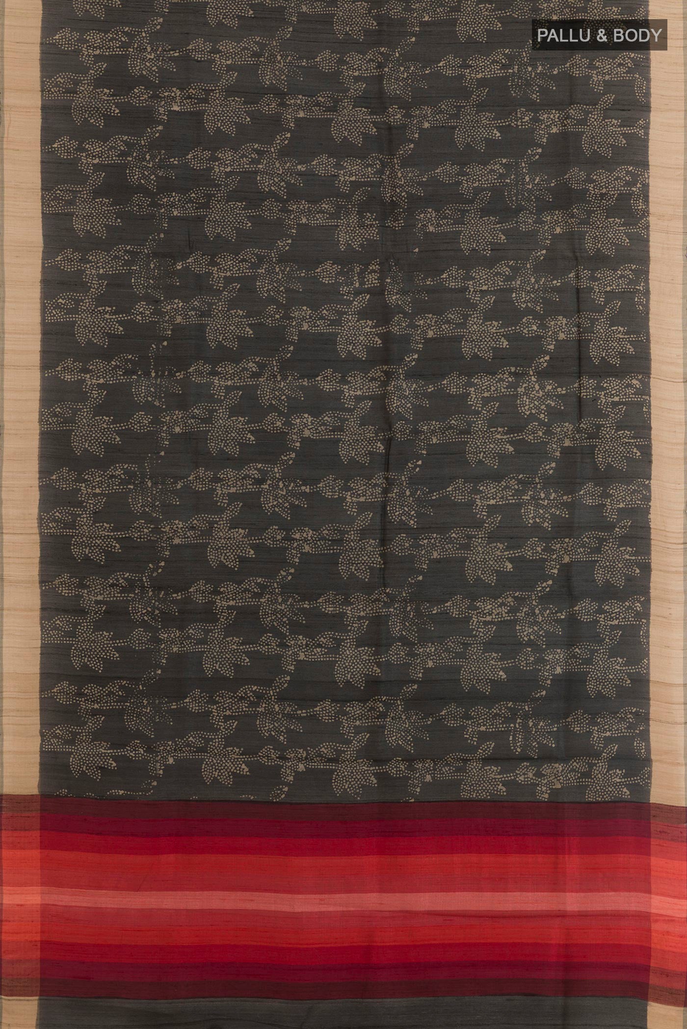 Flat view of Black Tussar Saree with Printed design on the body and Zari Border. 