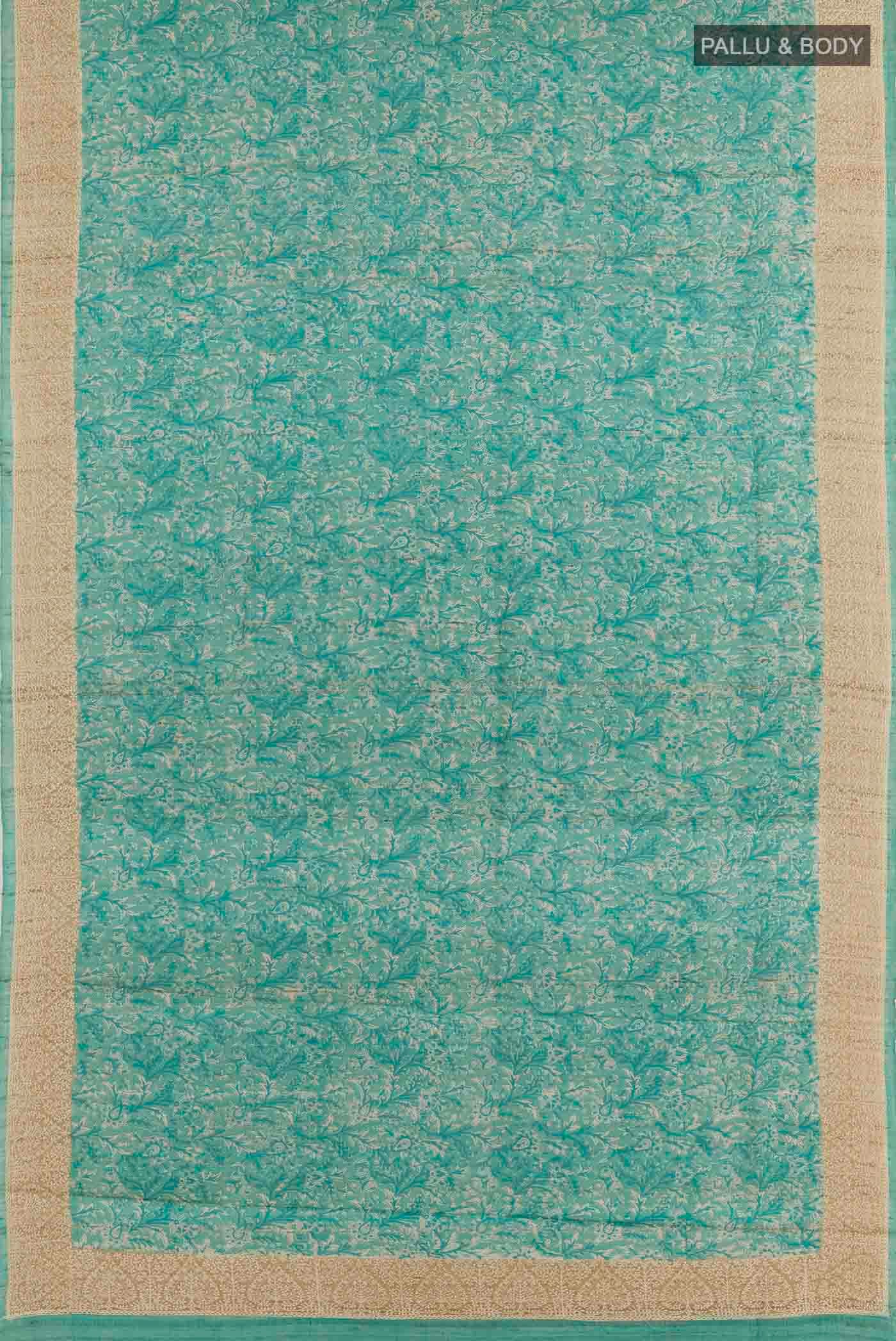 Flat view of Blue Tussar Saree with Printed design on the body and Embroidery Border