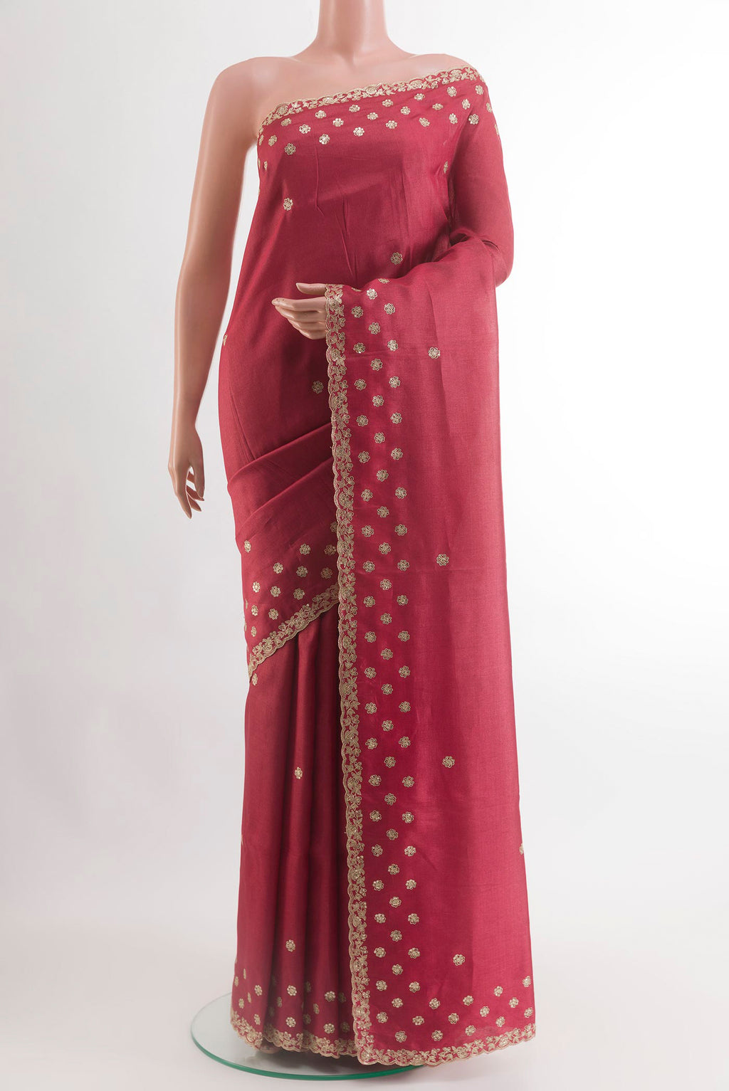 Maroon Tussar Silk Saree with Embroidery on the body and Embroidery Border.  displayed on a mannequin