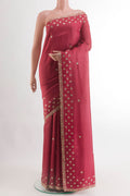 Maroon Tussar Silk Saree with Embroidery on the body and Embroidery Border.  displayed on a mannequin