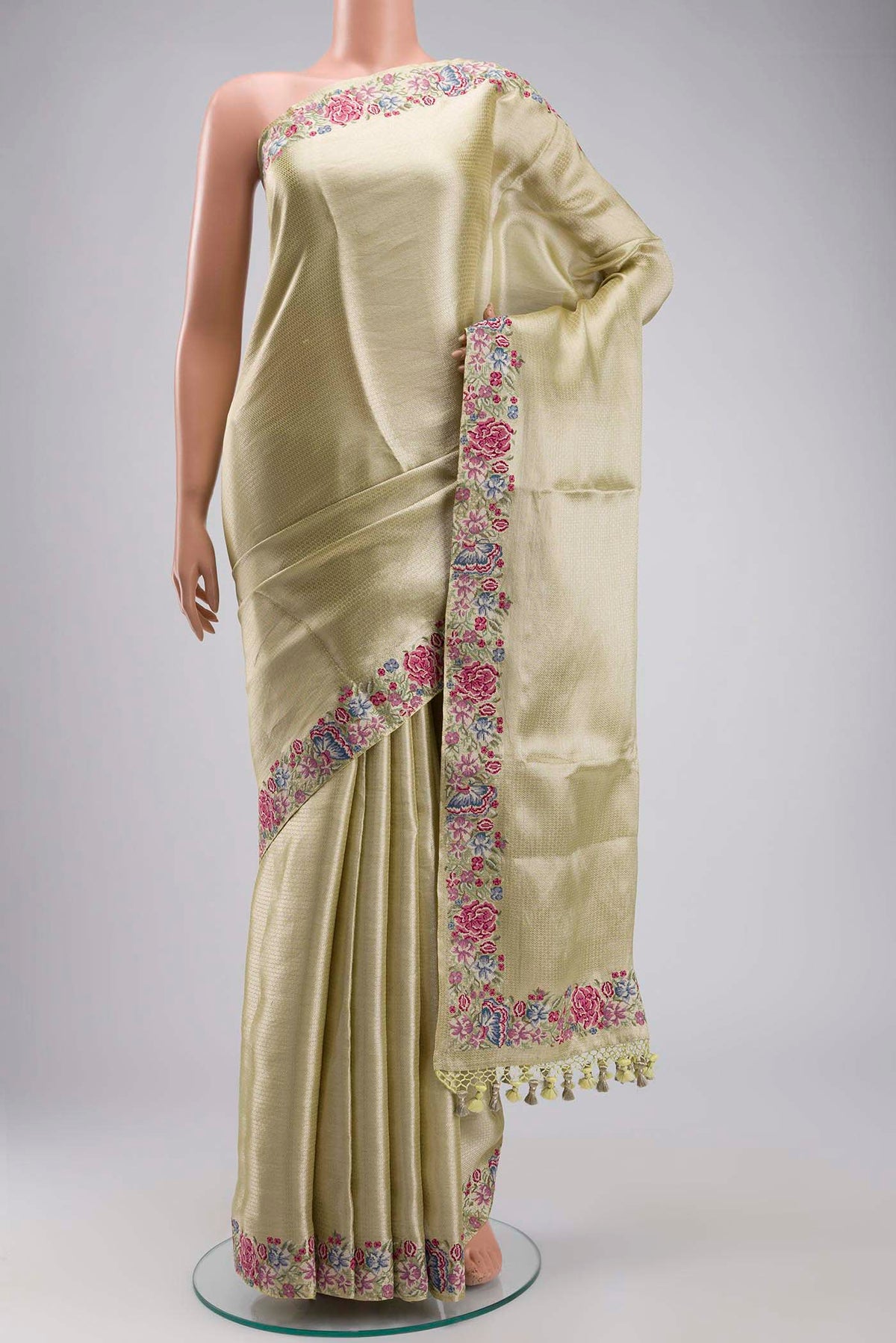 Yellow Tissue Silk Saree with Zari Brocade on the body and Embroidery Border displayed on a mannequin