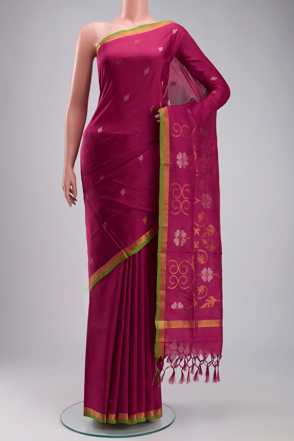 Pink Uppada Silk Saree with Zari Butta on the body and Zari Border displayed on a mannequin