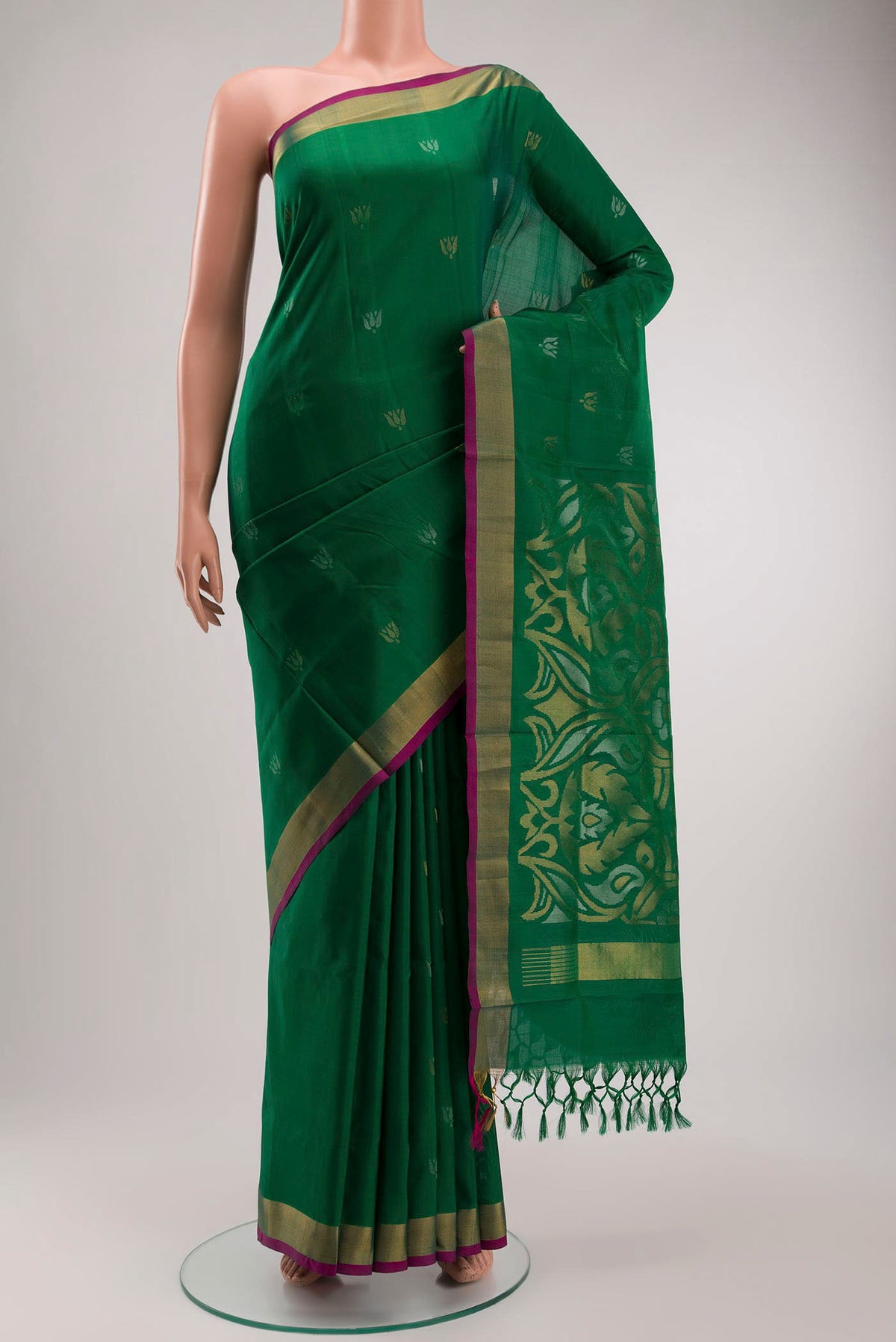 Green Uppada Silk Saree with Zari Butta on the body and Zari Border displayed on a mannequin