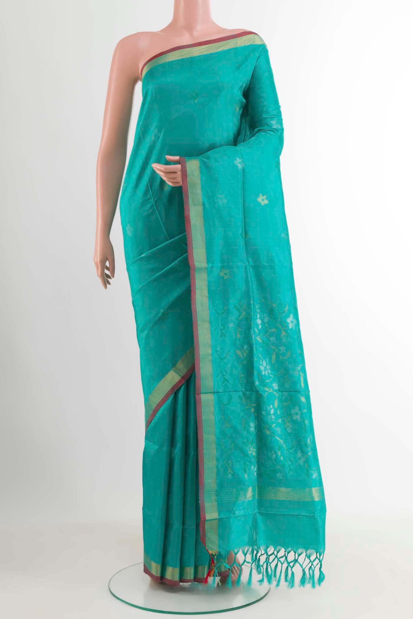 Turquoise Uppada Silk Saree with Zari Butta on the body and Zari Border displayed on a mannequin