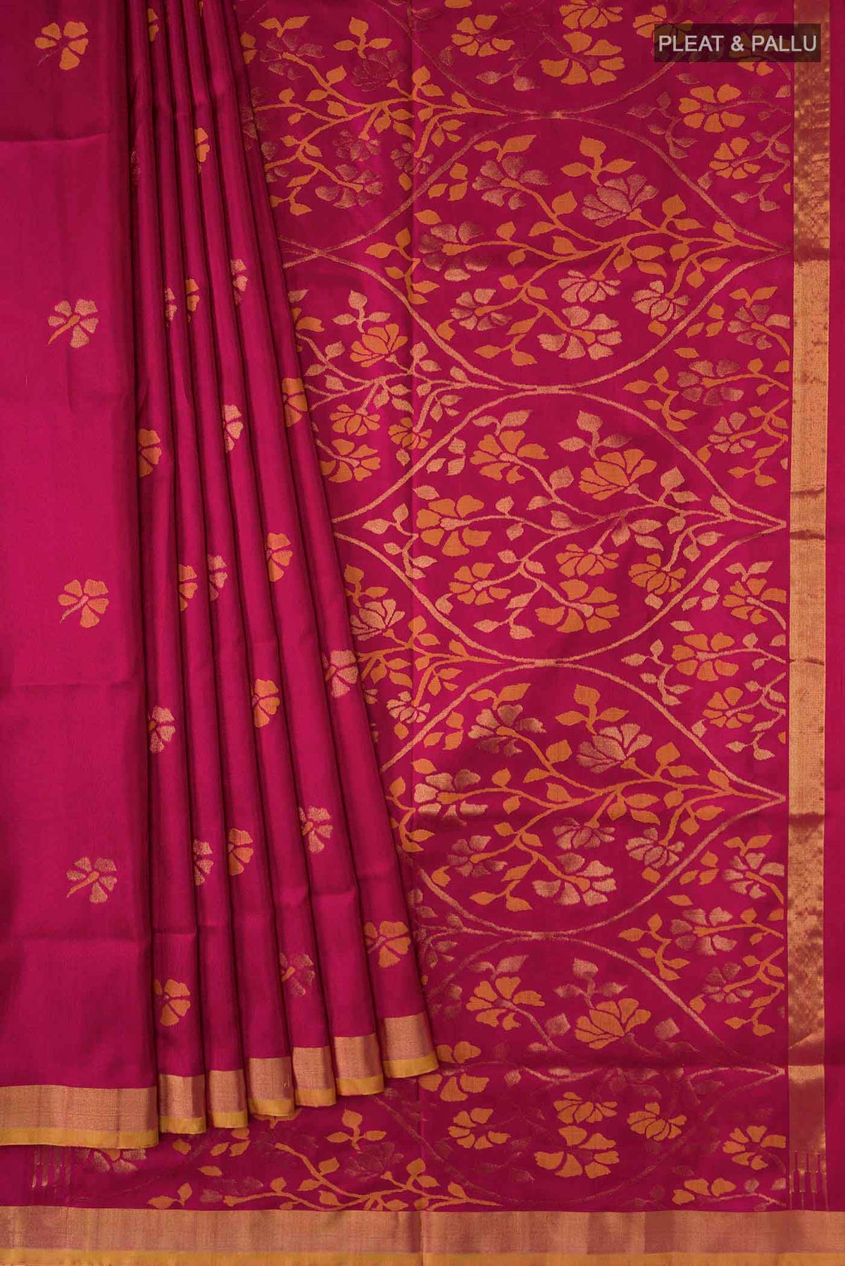 Pleats and pallu of Maroon Uppada Silk Saree with Zari Butta on the body and Zari Border
