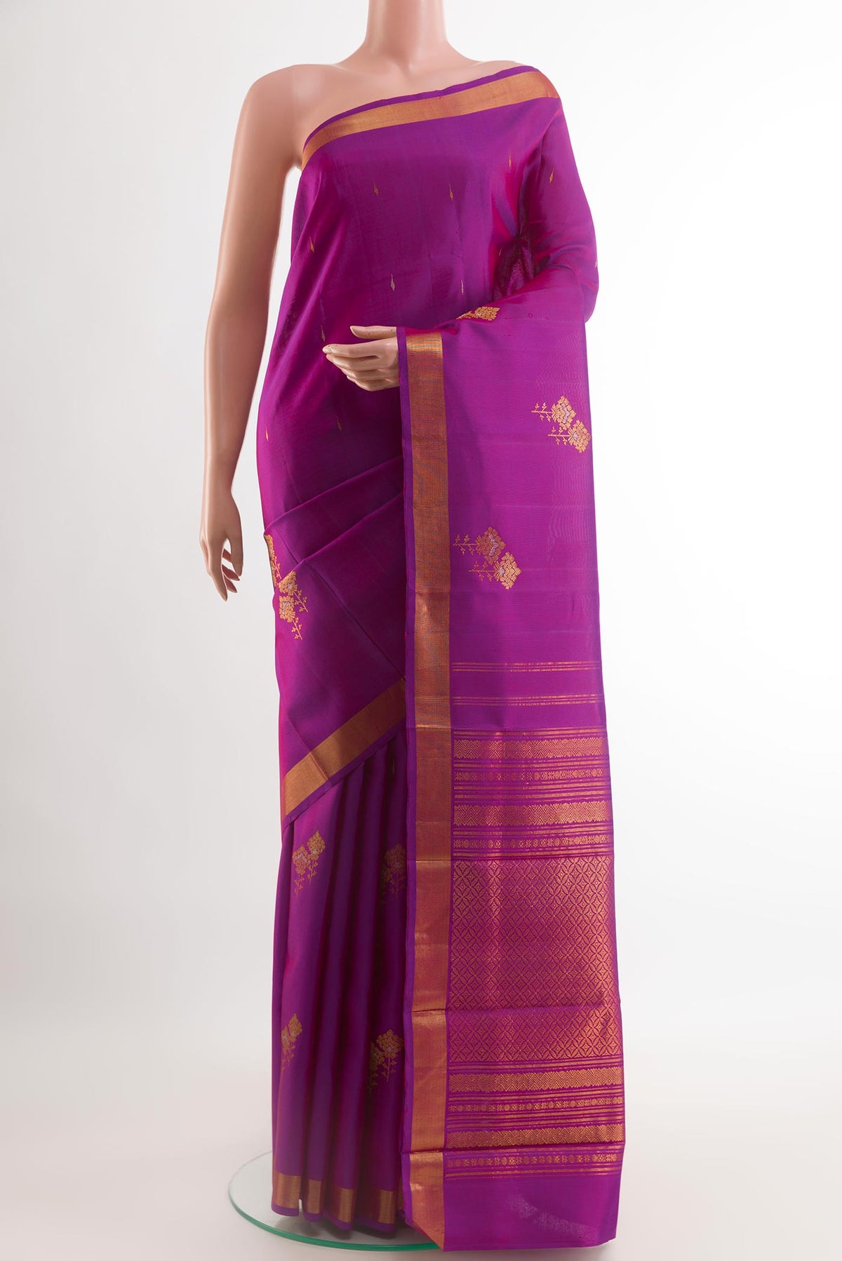 Purple Kanchipuram Silk Saree with Zari Butta on the body and Zari Border.  displayed on a mannequin