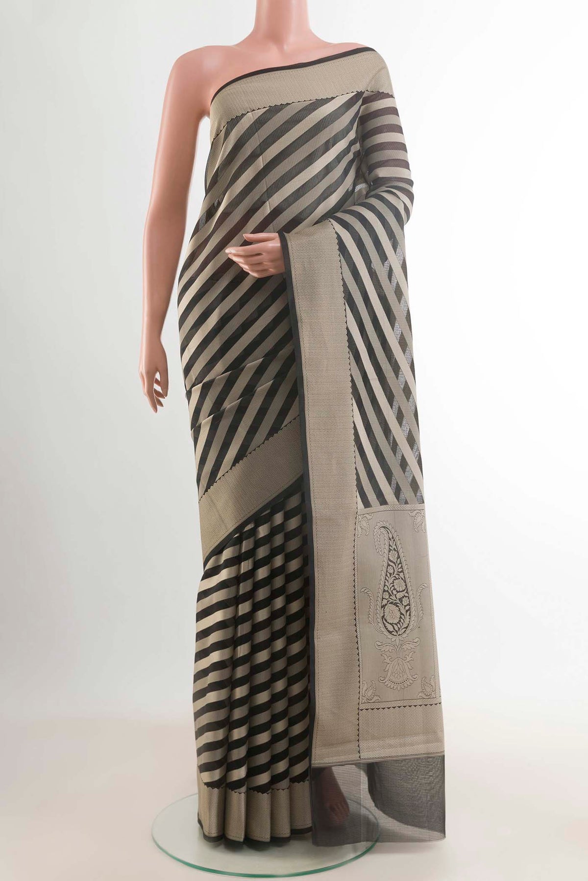 Black Blended Kota Cotton Saree with Stripes on the body and Zari Border displayed on a mannequin
