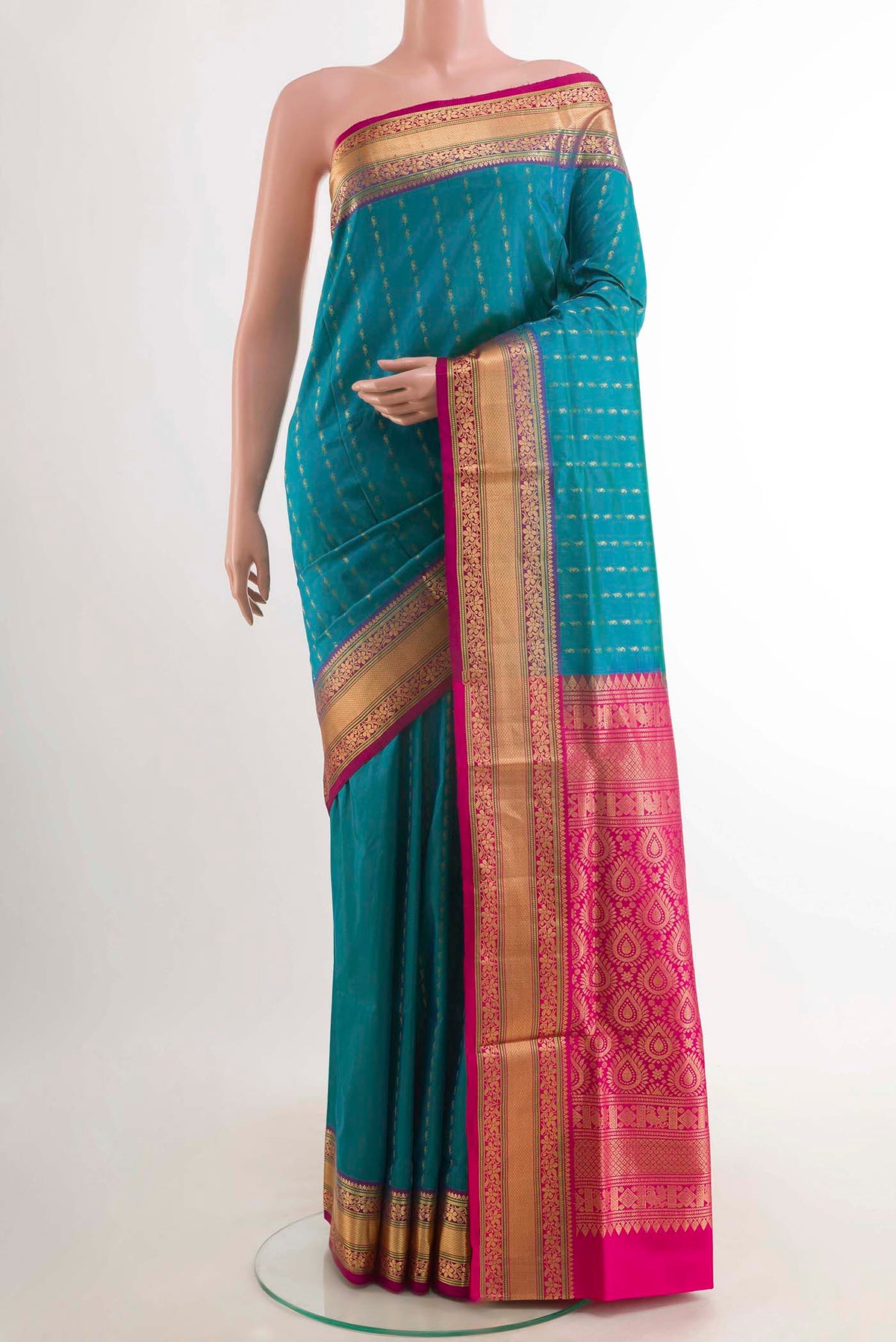 Blue Soft Silk Saree with Stripes on the body and Zari Border displayed on a mannequin