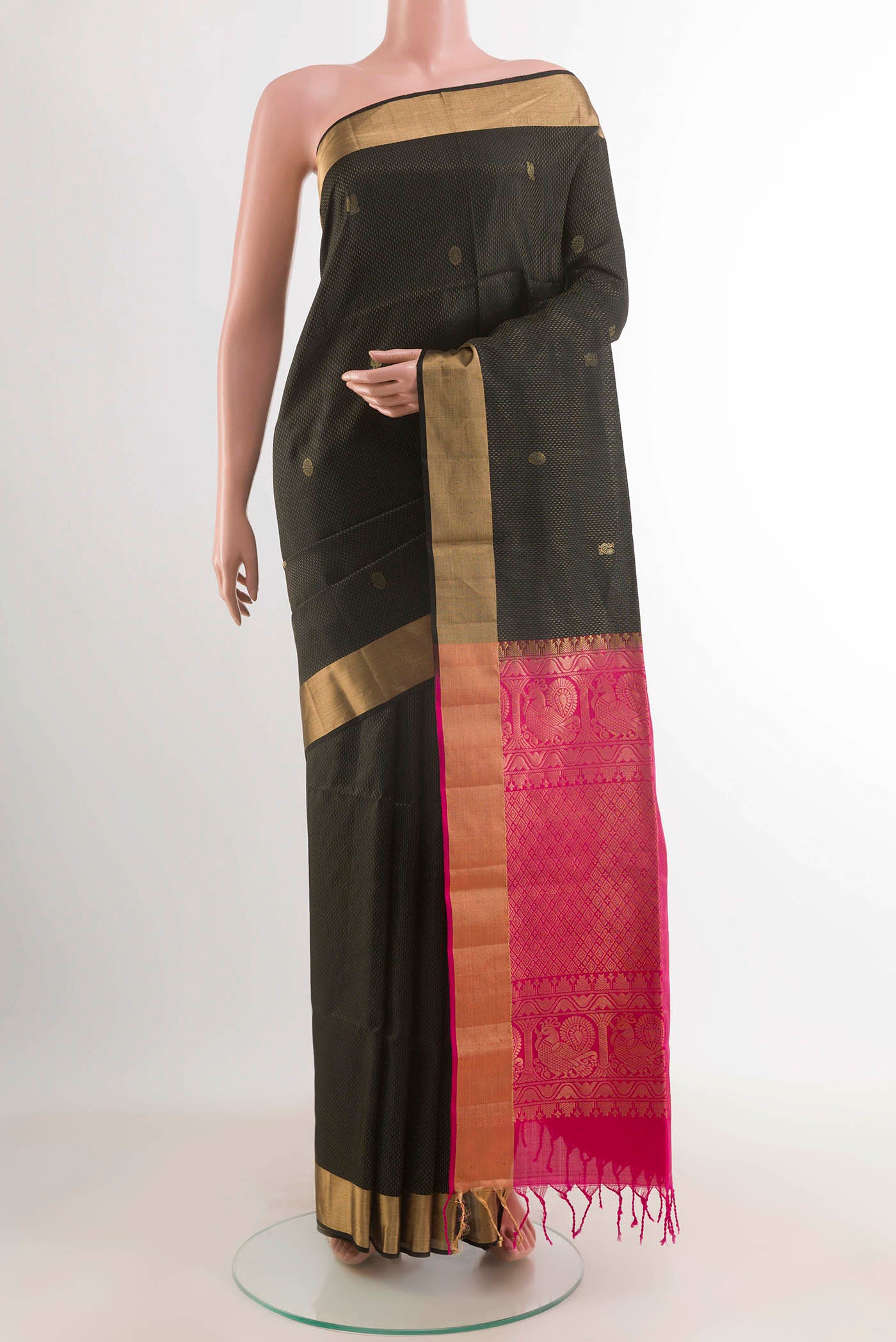 Black Soft Silk Saree with Zari Butta on the body and Zari Border displayed on a mannequin