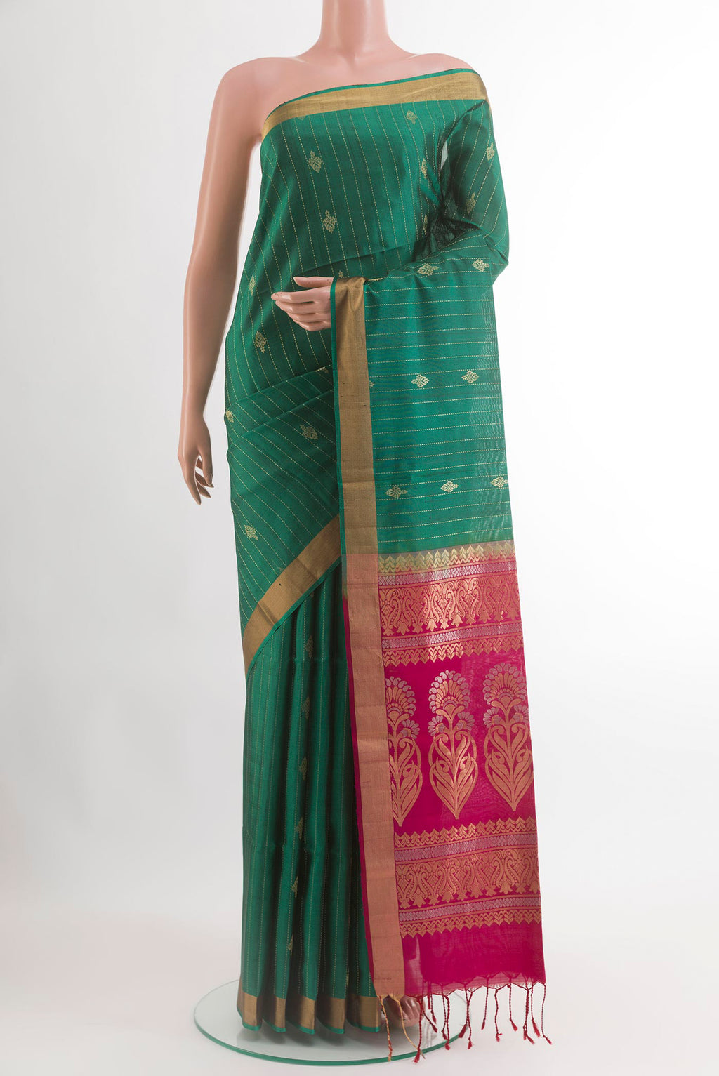 Green Soft Silk Saree with Stripes on the body and Zari Border.  displayed on a mannequin