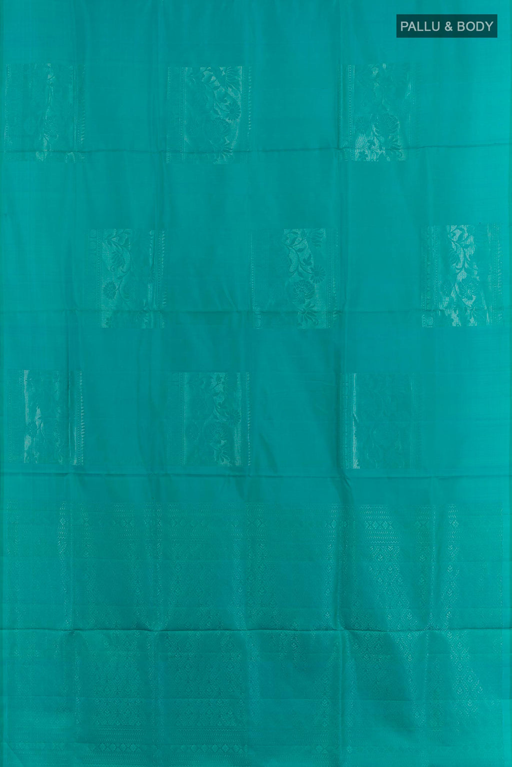 Flat view of Blue Dual Tone Soft Silk Saree with Zari Butta on the body and Zari Border. 