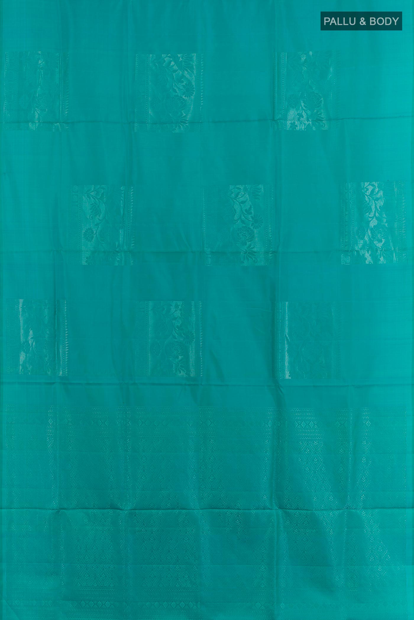 Flat view of Blue Dual Tone Soft Silk Saree with Zari Butta on the body and Zari Border. 
