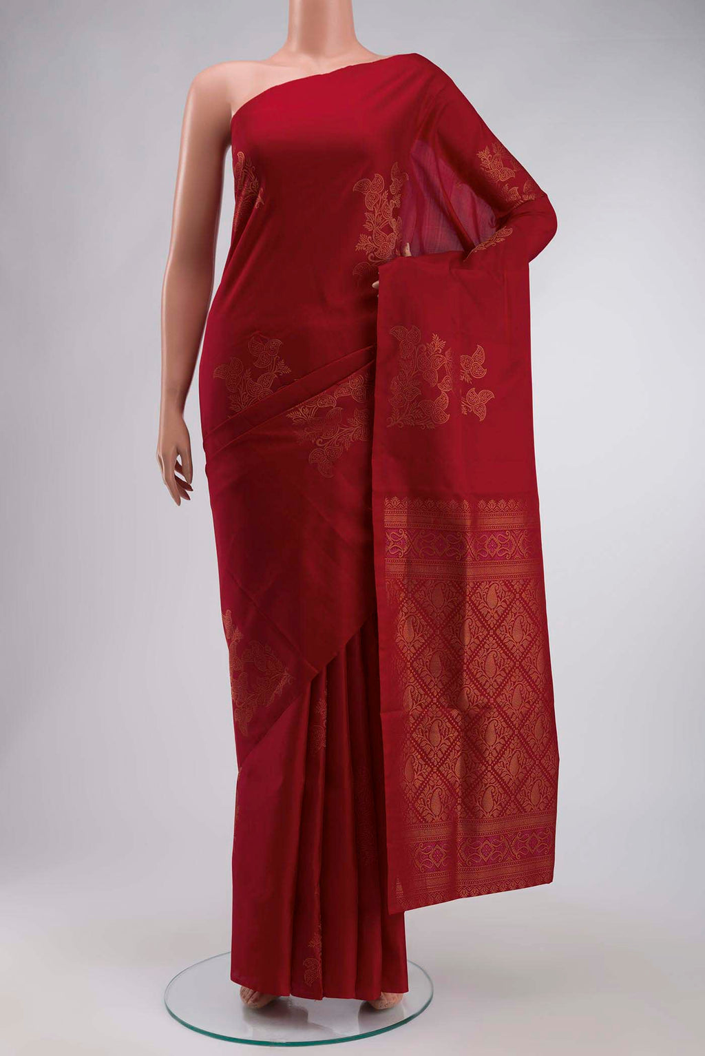 Maroon Soft Silk Saree with Zari Butta on the body and Zari Border displayed on a mannequin