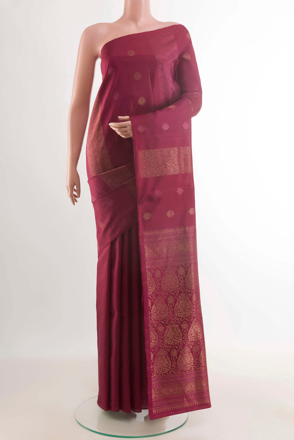 Maroon Soft Silk Saree with Zari Butta on the body and Without Border displayed on a mannequin