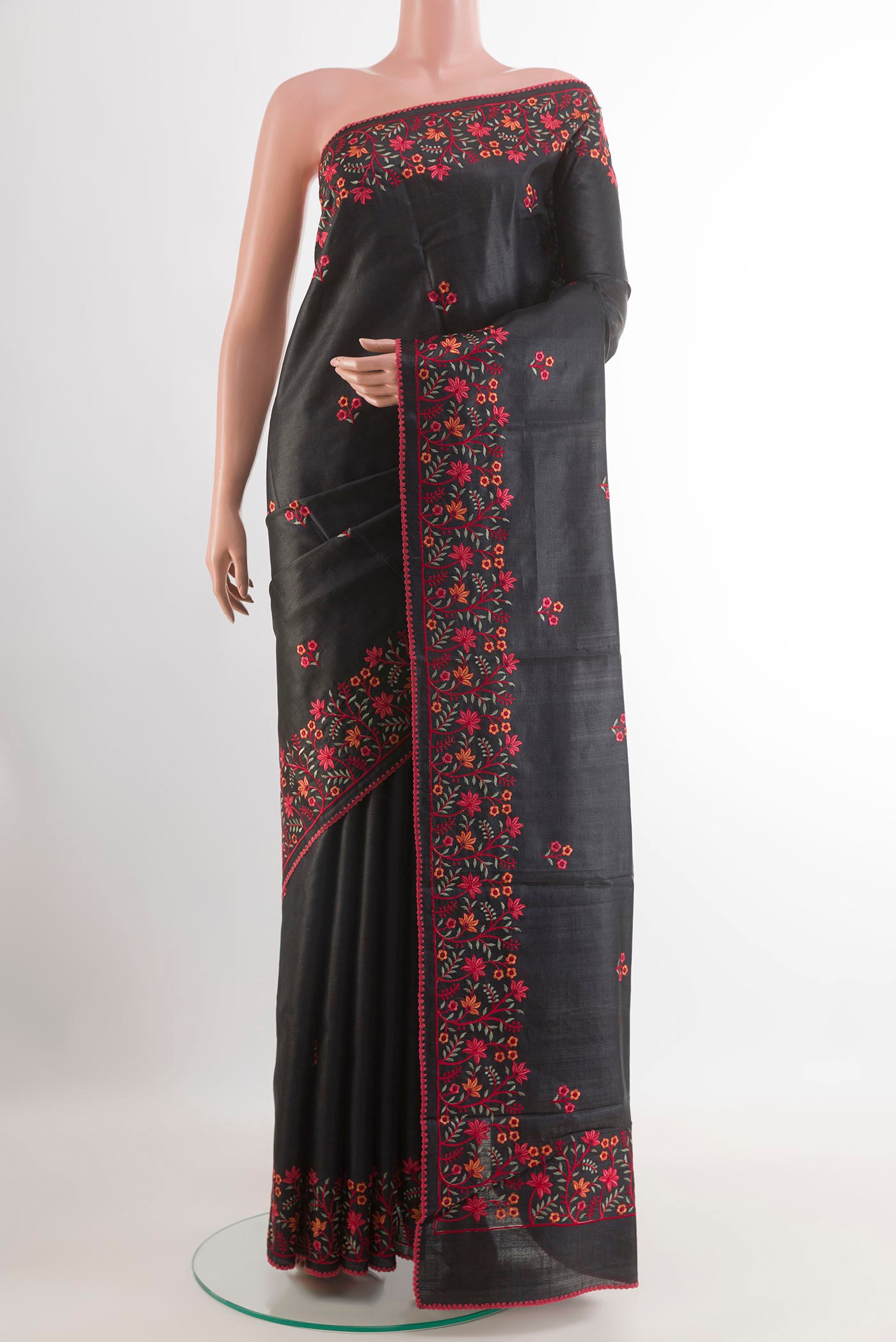Black Tussar Saree with Thread Butta on the body and Embroidery Border.  displayed on a mannequin