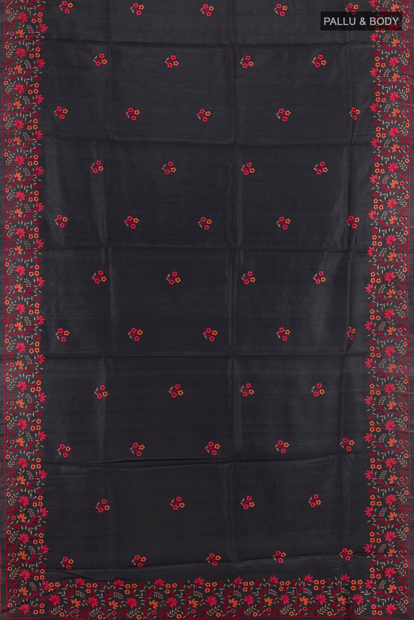 Flat view of Black Tussar Saree with Thread Butta on the body and Embroidery Border. 