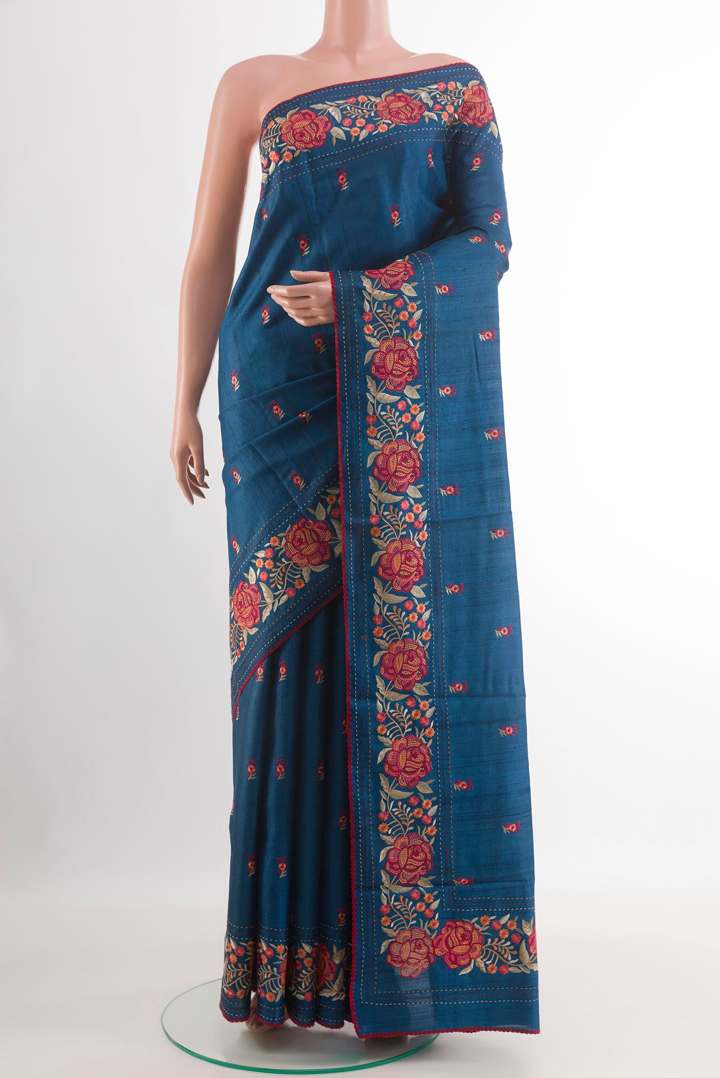 Blue Tussar Saree with Thread Butta on the body and Embroidery Border.  displayed on a mannequin