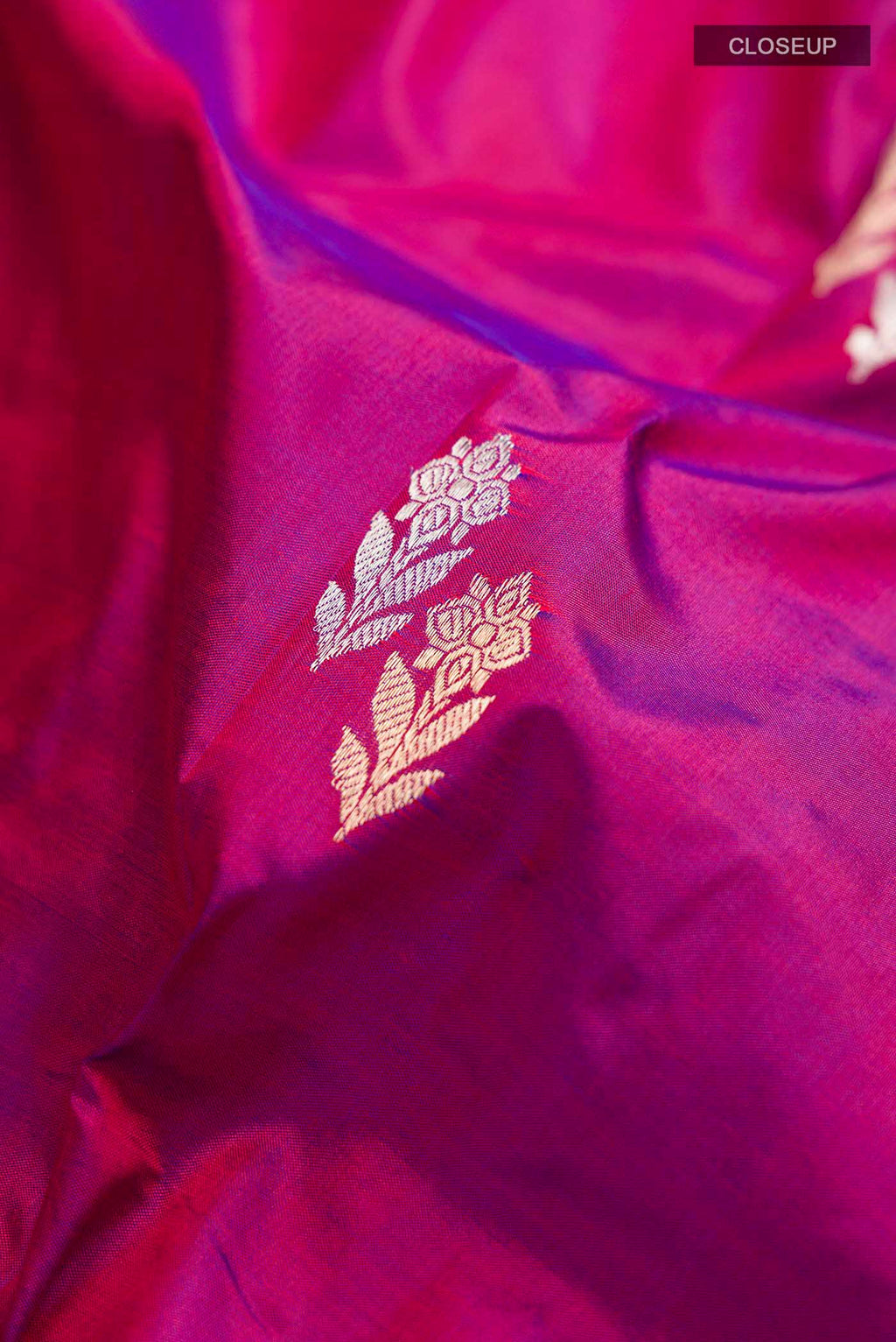Close up of Purple Banarasi Katan Silk Saree with Zari Butta on the body and Zari Border displaying folds