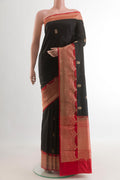 Black Banarasi Katan Silk Saree with Zari Butta on the body and Zari Border.  displayed on a mannequin
