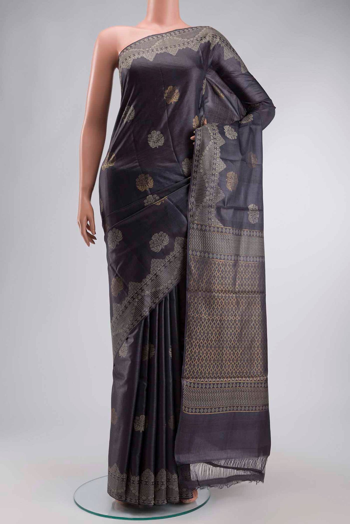 Grey Tussar Silk Saree with Zari And Thread Butta on the body and Thread Border displayed on a mannequin