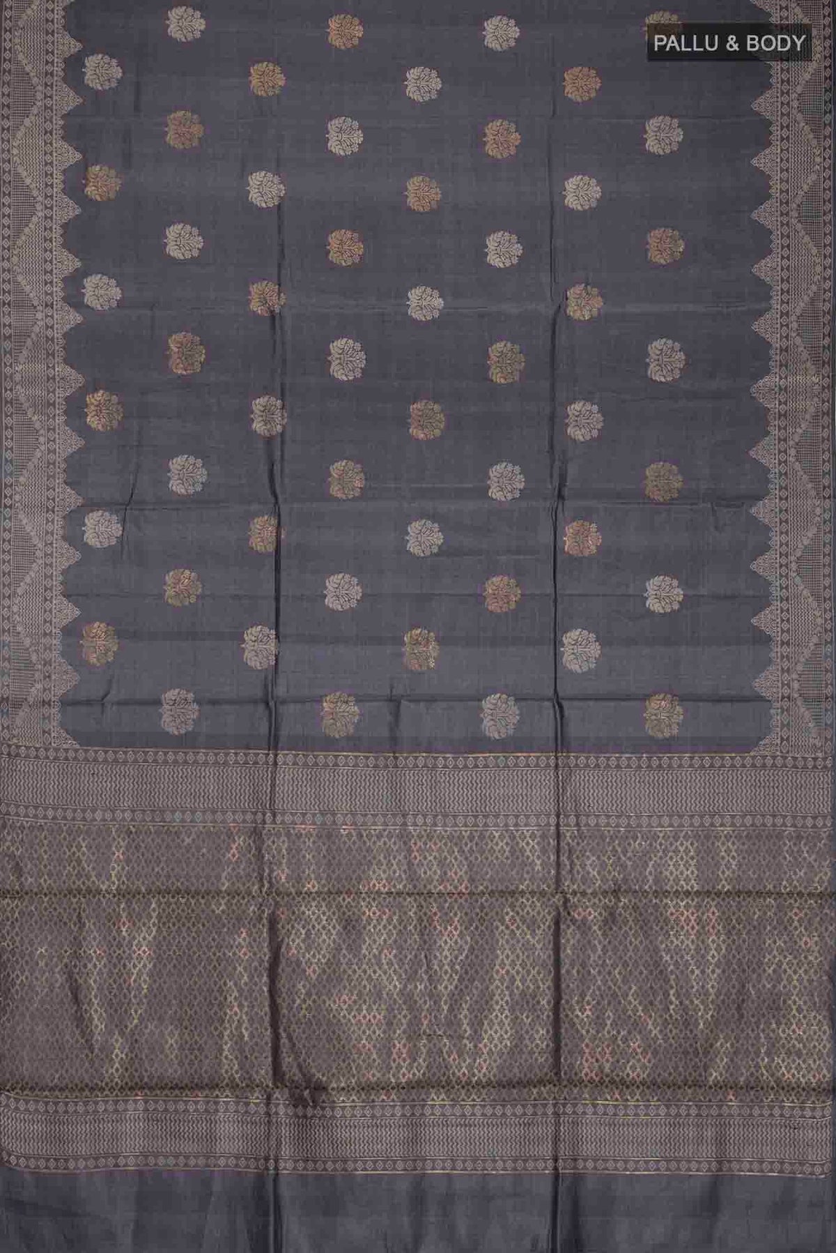 Flat view of Grey Tussar Silk Saree with Zari And Thread Butta on the body and Thread Border