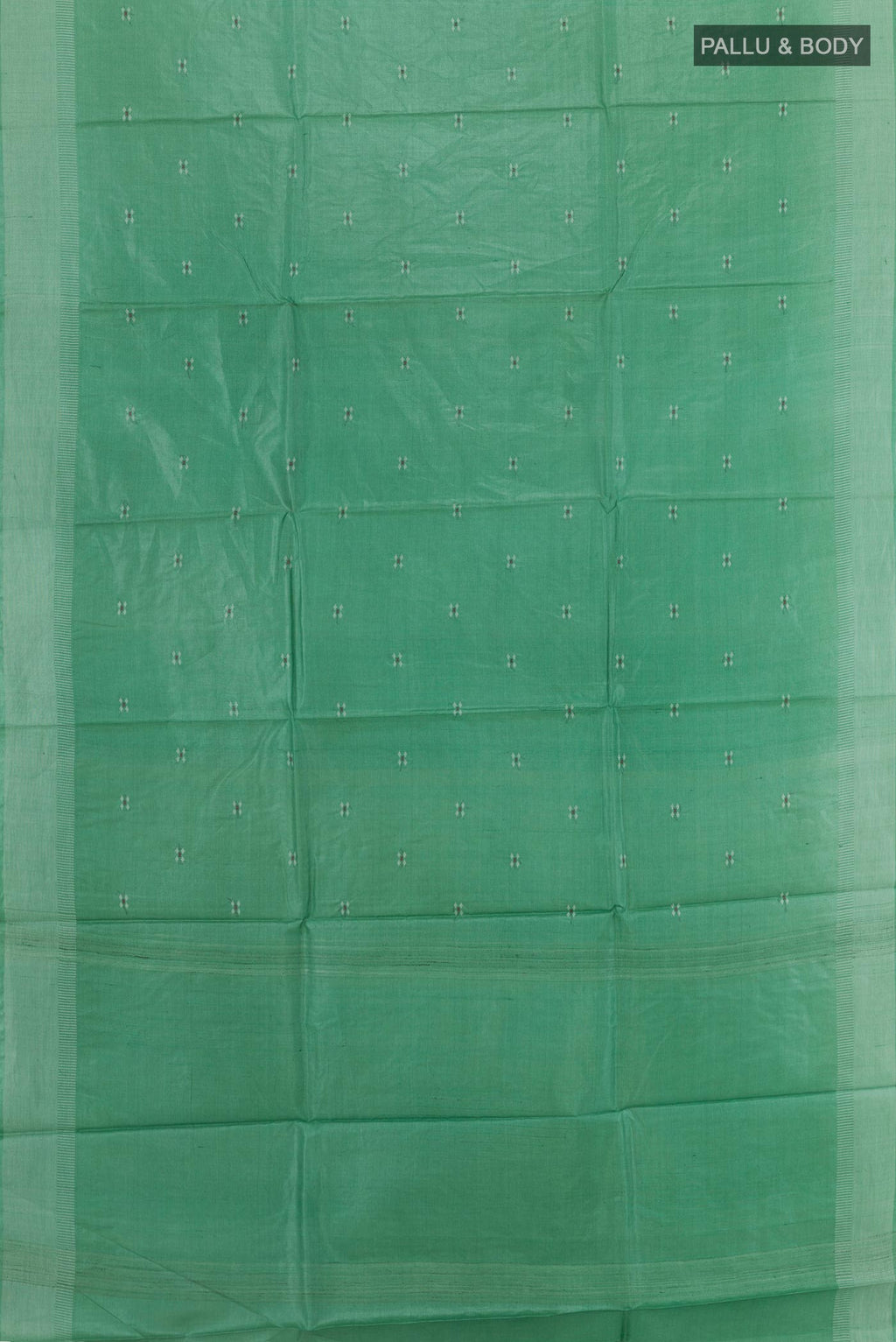 Flat view of Sea Green Tussar Silk Saree with Thread Butta on the body and Zari Border. 
