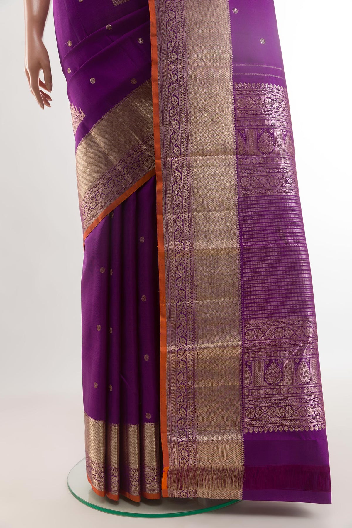 Pleats and pallu of Purple Kanjivaram Silk Saree with Zari Butta on the body and Zari Border. 