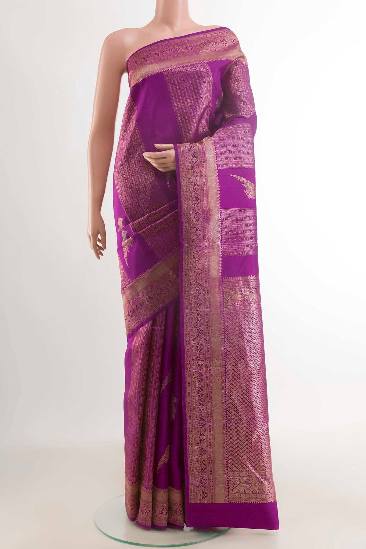 Purple Kanchipuram Silk Saree with Zari Butta on the body and Zari Border displayed on a mannequin