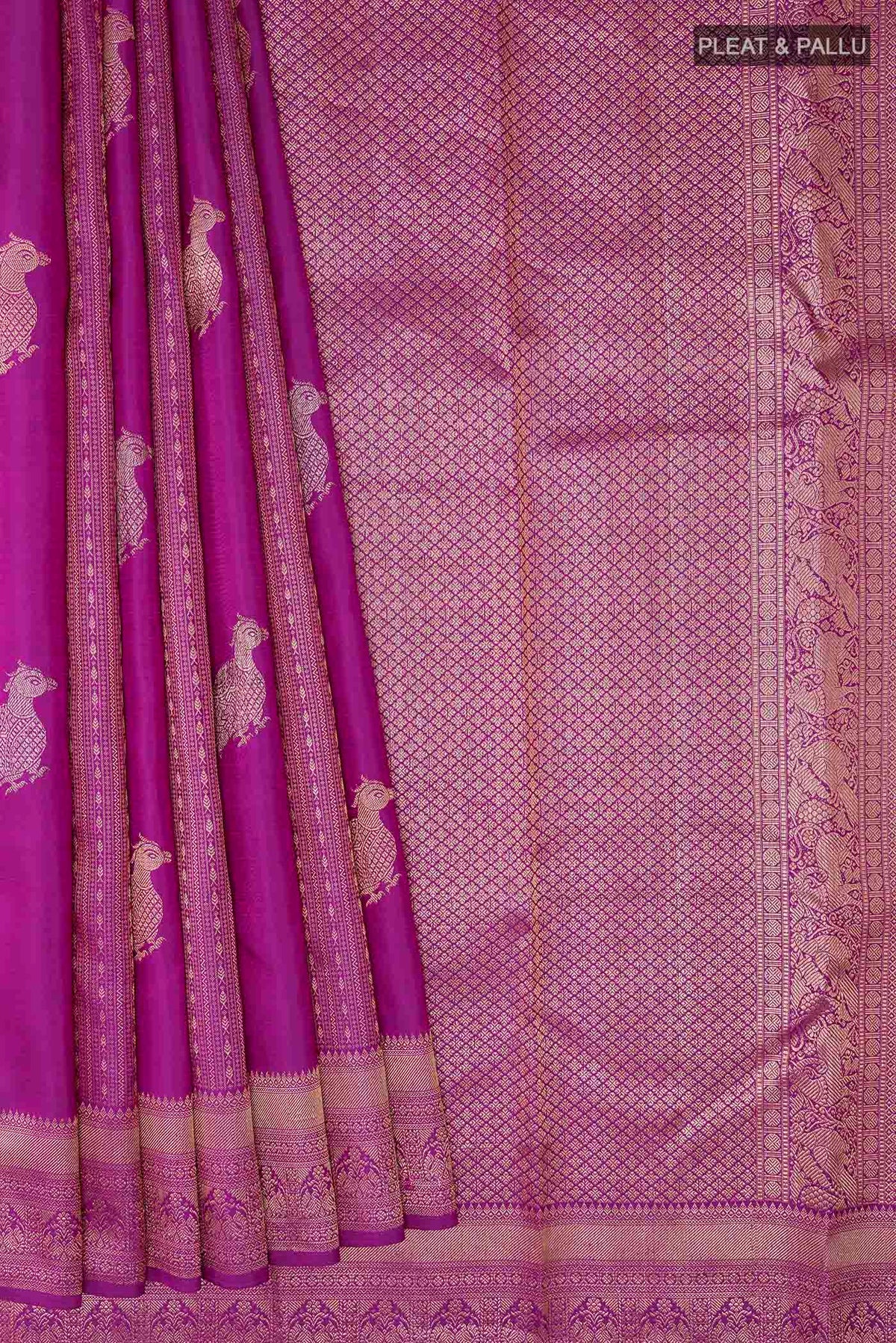 Pleats and pallu of Purple Kanchipuram Silk Saree with Zari Butta on the body and Zari Border