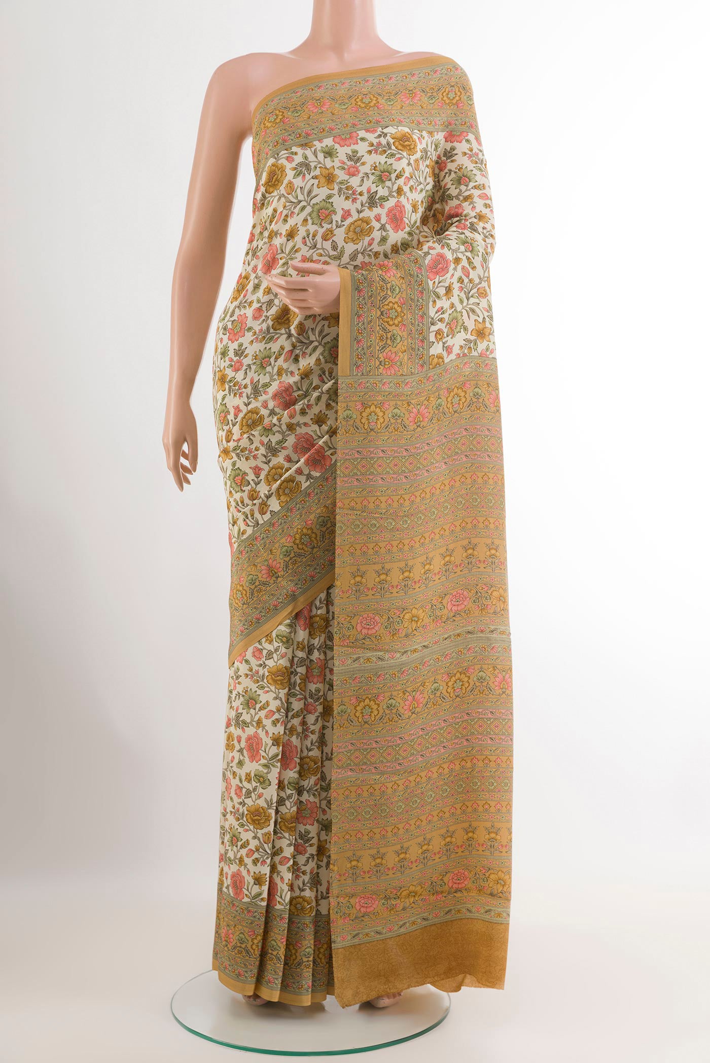 Off White Crepe Saree with Printed design on the body and Plain Border.  displayed on a mannequin